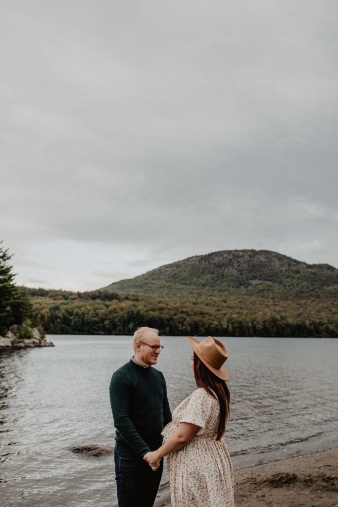 couple on a beach with mountain in the background, best place to elope in the eastern townships